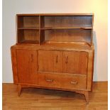 A Retro 1960's/70's sideboard, with open shelved upstand above fitted drawer and doors,