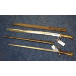 Two 19th century French bayonets, with leather and metal scabbard, 52cm x 56.