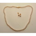 A pearl necklace and earring set, with 14ct gold clasp and backs, pearls 22cm long (fastened),