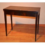 A Georgian style mahogany inlaid fold over card table, enclosing green felt lined interior,