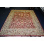 A Persian carpet, the overall cream floral motif over red ground, with cream and red border,