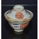 A Chinese famille rose tea bowl with cover, decorated with panels of dragons and mythical beasts,