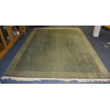 A green Chinese style carpet by John Lewis, of plain design with cream lined border,