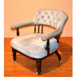 A Victorian mahogany framed parlour armchair, with hoop frame, upholstered in pale blue velour,