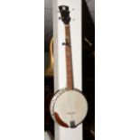 A four string tenor banjo, with mother of pearl style decoration,