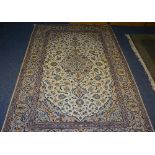 A fine Keshan carpet, in new condition, with central foliate medallion,