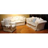 A three piece lounge suite, comprising of small and large two seater settee and armchair,