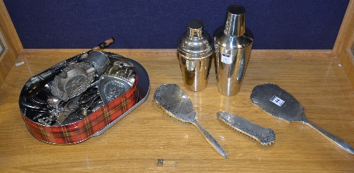 A Birmingham 1955 silver backed dressing table set, comprising of mirror and two brushes,