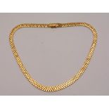 An 18ct gold brick link necklace, stamped 750 to clasp, 20.5cm long, 40.