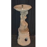 A garden stoneware bird bath, in the form of a classical child, raised on base,