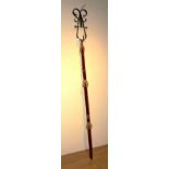 A reproduction medieval weapon, with velour upholstered pole and metal fork,