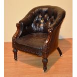 A Victorian Captains armchair, with mahogany frame and button back leather,