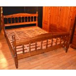 A modern pine double bed by Duckers, label to end, with slatted base,