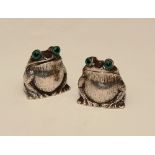 A pair of novelty Birmingham silver frog condiments, with green glass eyes, one salt, one pepper,