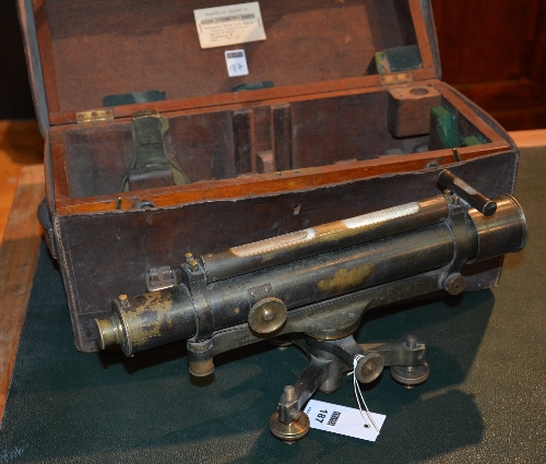 A vintage surveyors theodolite by Troughton & Simms London, with accessories in fitted wood box,