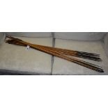 A quantity of Peruvian spears/arrows with bow, the arrows with bamboo body,