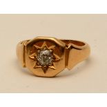 A Victorian 18ct gold and diamond signet ring, with old cut diamond to centre within star setting,