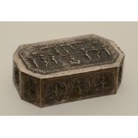 An Indian white metal box embossed with Indian figures/deities, with cushioned interior,