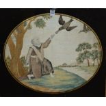 A 19th century needlepoint panel on silk, depicting man in robe feeding birds within tree landscape,