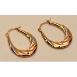 A pair of 9ct gold white and yellow gold hoop earnings, stamped 375 to clasp, 1g, 2.