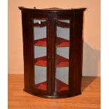 A Georgian mahogany wall hanging corner cabinet,