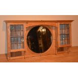 A pine over mantel designed by Patrick Geddes circa 1910, the central circular mirror,