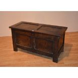 An 18th century oak coffer, with hinged top,