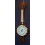 An oak Banjo barometer, with thermometer gauge (crack to glass),