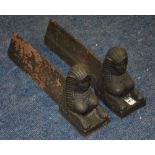 A pair of cast iron fire dogs, modelled with sphinx busts,