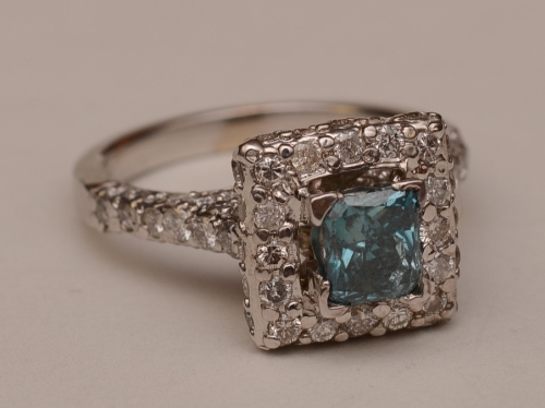 A 14ct white gold blue topaz and diamond ring,