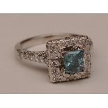 A 14ct white gold blue topaz and diamond ring,
