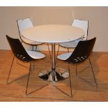 An Italian designer composition circular table with four chairs,