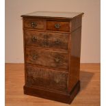 A reproduction walnut chest of drawers, with two small drawers above three long drawers,