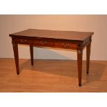 A reproduction hardwood writing/side table, with three small drawers, raised on tapering supports,