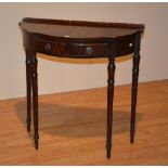 A reproduction mahogany occasional table, with shaped top above two small drawers,