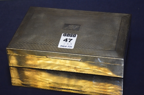 A silver cigarette box, bearing rubbed marks for Birmingham,