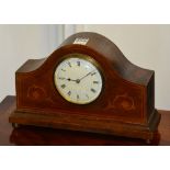 An Edwardian mahogany inlaid mantel clock, the dial movement made from brass military shell casing,