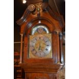 A George III oak longcase clock by John Spencer, the hood with gilt eagle and ball surmount,