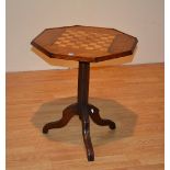 A Victorian mahogany and rosewood games table, with octagonal top,