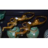 A pair of Chinese brass monkey curtain holders,