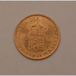 A 1911 Dutch gold Wilhelmina coin, 6.