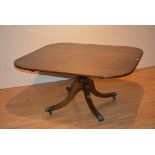 A 19th century mahogany tilt top breakfast table, the square top with canted corners,