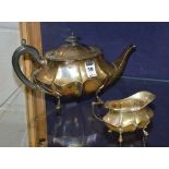 A silver teapot and matching milk jug, hallmarks for Sheffield 1930-31, initialed 'PA+S',