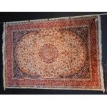 A Kashan carpet, with floral motifs on beige ground,
