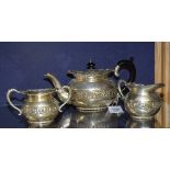 An Indian silver three piece tea set, comprising of teapot, sugar and cream,