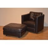 A contemporary brown leather armchair, 75cm high x 82cm wide,