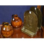 A pair of Art Pottery ewers, 24cm high, also with a pair of vintage brass candle sconces,