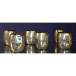 A set of six unmarked Indian silver cups stamped 'Vummidiary Jewellers Madras' to base,