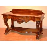 A good quality Victorian mahogany serpentine hall table, with deep drawer above undertier,