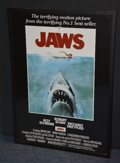 A reproduction movie poster of 'Jaws', in black slip,